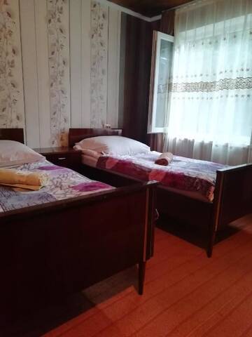 Фото номера Стандартный двухместный номер с 2 отдельными кроватями и видом на сад Гостевой дом Guest House Carpediem г. Becho 2